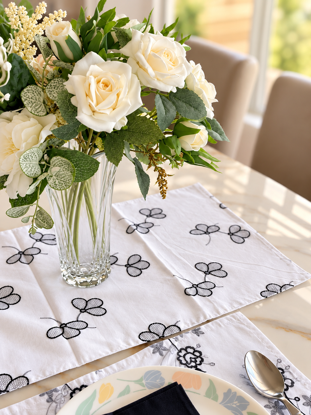 Placemat with black and grey floral motif
